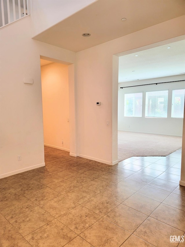 empty room with light tile patterned floors