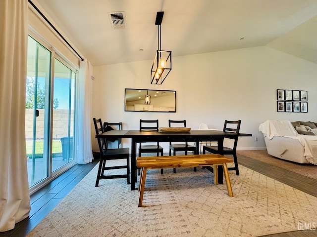 7303 Wild Mustang Dr, Bakersfield, CA 93311 - dining room featuring vaulted ceiling and wood finished floors