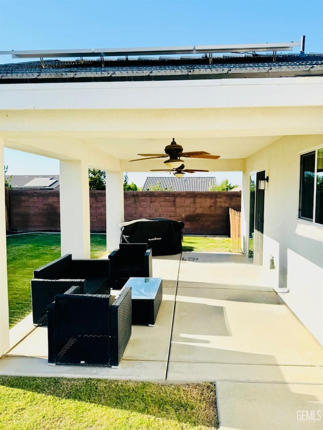 7303 Wild Mustang Dr, Bakersfield, CA 93311 - fenced backyard featuring ceiling fan, a patio area, and an outdoor hangout area
