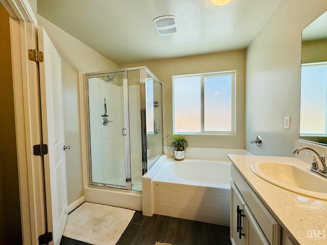 7303 Wild Mustang Dr, Bakersfield, CA 93311 - bathroom featuring plenty of natural light, a shower stall, vanity, and a garden tub