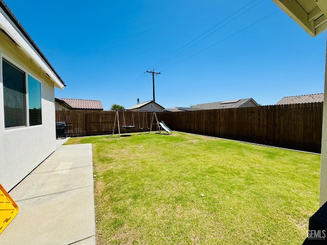 7303 Wild Mustang Dr, Bakersfield, CA 93311 - fenced backyard with a playground