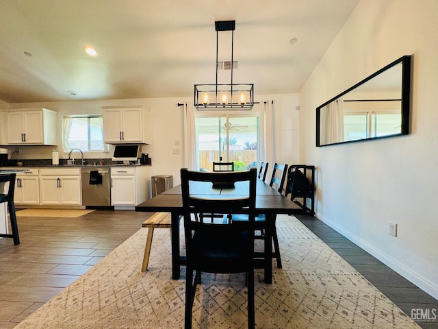 7303 Wild Mustang Dr, Bakersfield, CA 93311 - dining room with a chandelier, dark wood finished floors, and recessed lighting