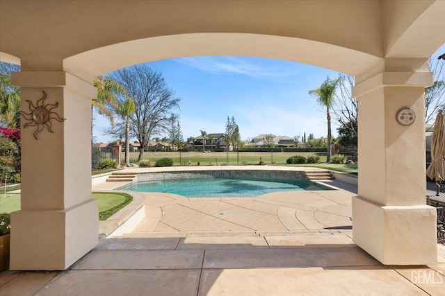 outdoor pool featuring a patio