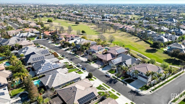 birds eye view of property with a residential view and view of golf course