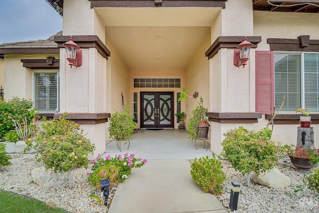 property entrance featuring french doors