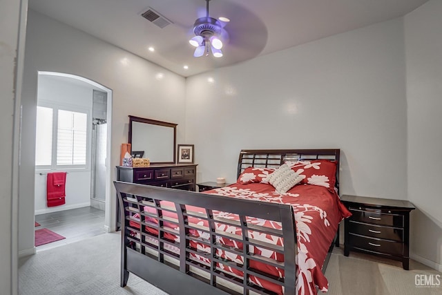 bedroom with ceiling fan and light carpet