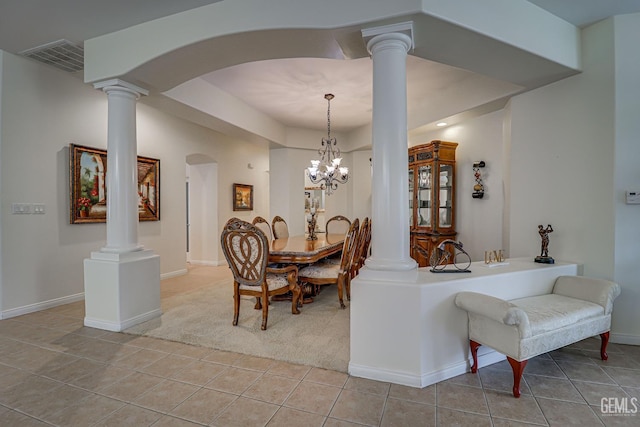 dining room featuring light tile patterned floors and a chandelier