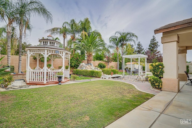 view of yard featuring a gazebo and a pergola