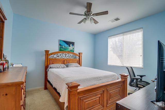 bedroom with light colored carpet and ceiling fan