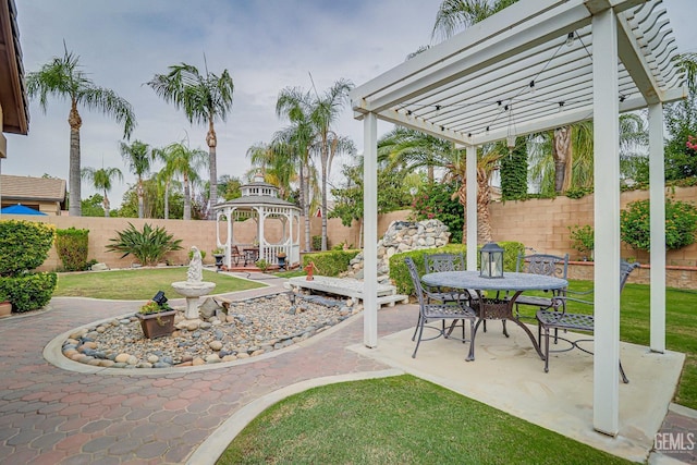 view of yard with a pergola and a patio