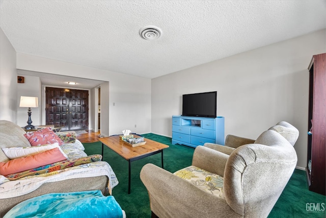 carpeted living room with a textured ceiling