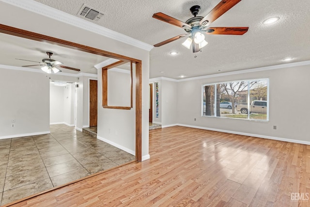 unfurnished living room with ceiling fan, crown molding, light hardwood / wood-style flooring, and a textured ceiling