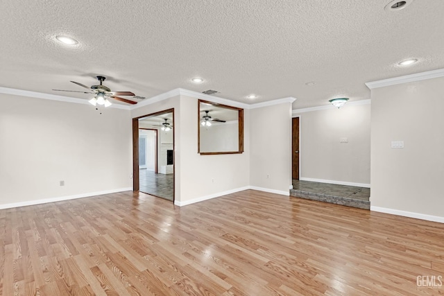 unfurnished living room featuring ornamental molding, a textured ceiling, and light hardwood / wood-style flooring