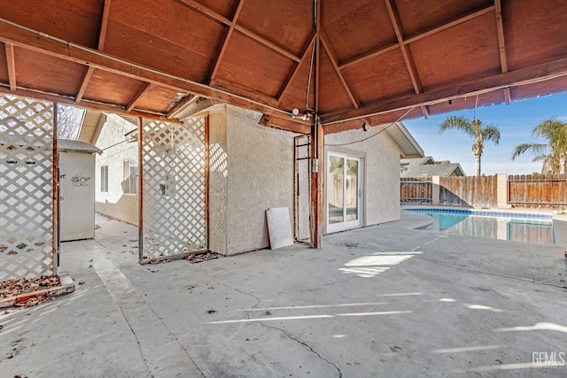 view of patio with a fenced in pool