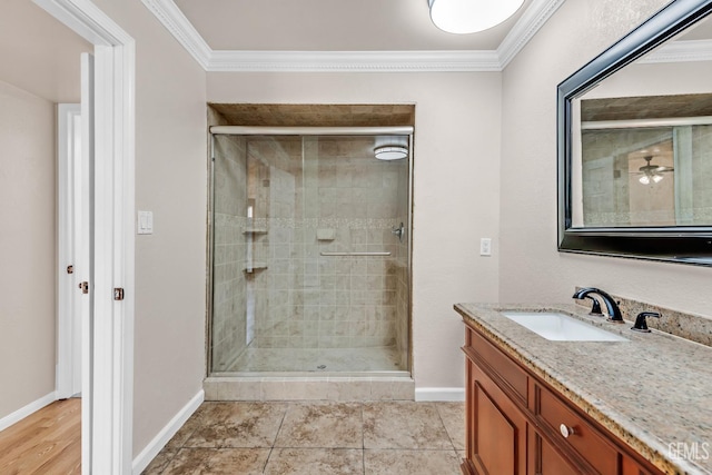 bathroom featuring crown molding, tile patterned floors, vanity, and a shower with shower door