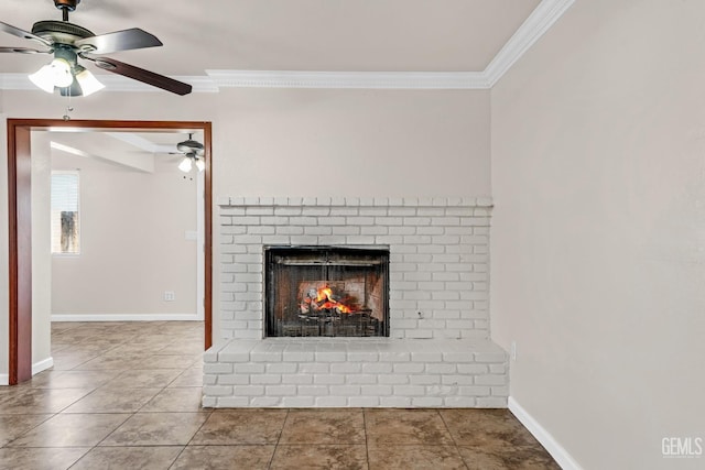 interior details featuring a fireplace, ornamental molding, and ceiling fan