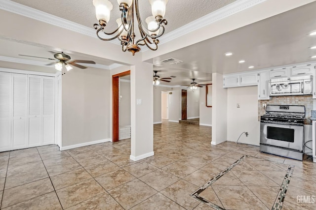 kitchen with crown molding, appliances with stainless steel finishes, backsplash, white cabinets, and decorative light fixtures