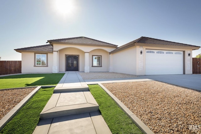 view of front facade featuring a garage and a front lawn