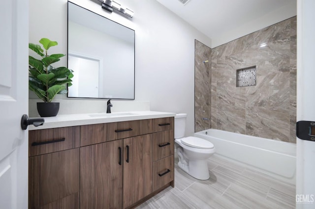 full bathroom featuring shower / tub combination, vanity, and toilet