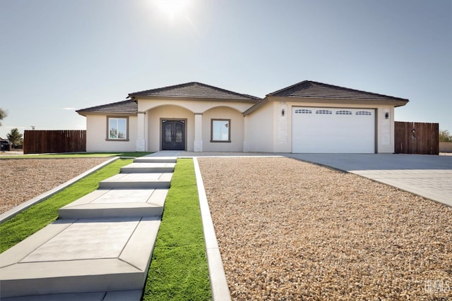 ranch-style house featuring a garage