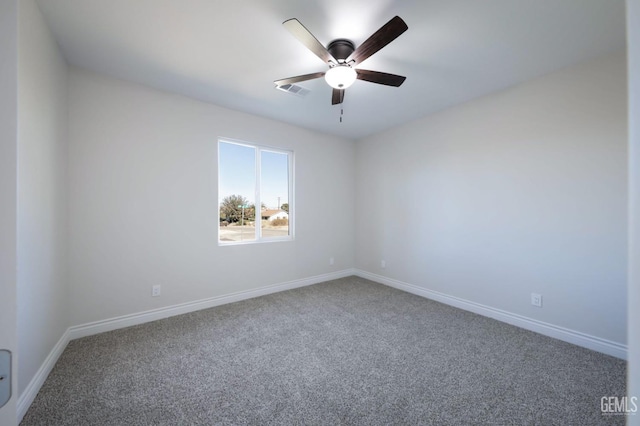 spare room with carpet floors and ceiling fan