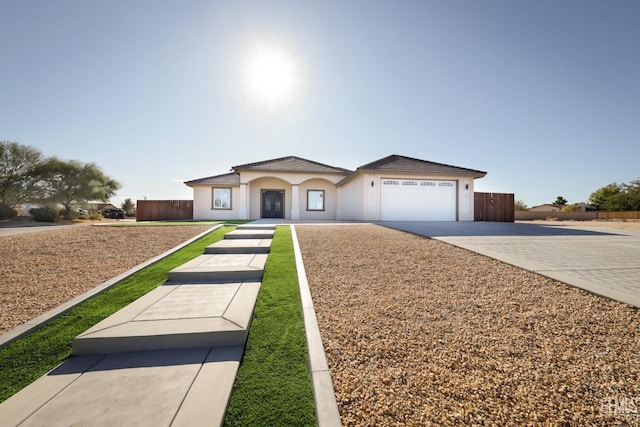 ranch-style house featuring a garage