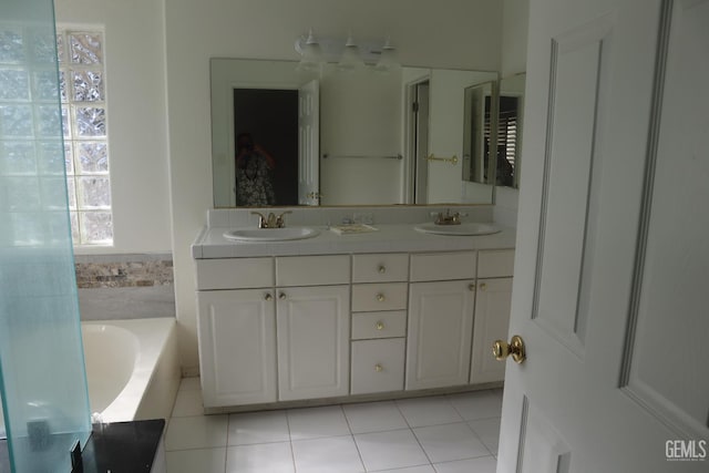 5808 Greenhorn Mountain Ct, Bakersfield, CA 93313 - bathroom featuring double vanity, a bath, and tile patterned floors