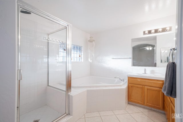 bathroom featuring vanity, separate shower and tub, and tile patterned flooring