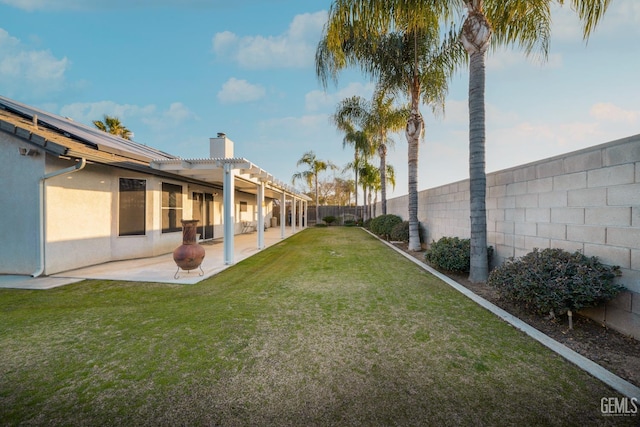 view of yard with a pergola and a patio