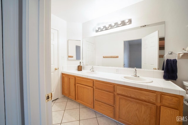 bathroom with vanity and tile patterned floors