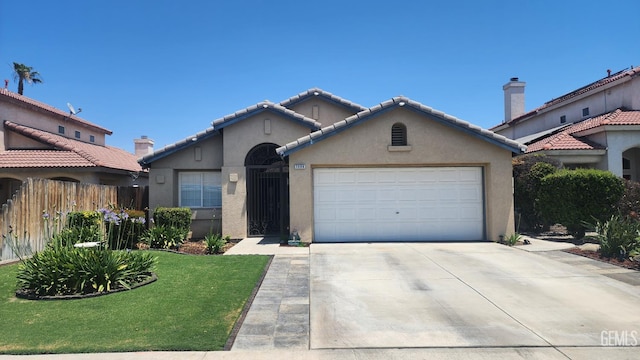 3808 Mariana Way, Bakersfield, CA 93311 - mediterranean / spanish-style home featuring concrete driveway, stucco siding, an attached garage, and a tiled roof