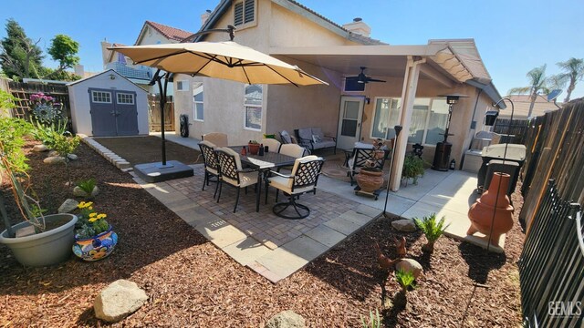 3808 Mariana Way, Bakersfield, CA 93311 - rear view of house with stucco siding, ceiling fan, a fenced backyard, outdoor lounge area, and a patio area