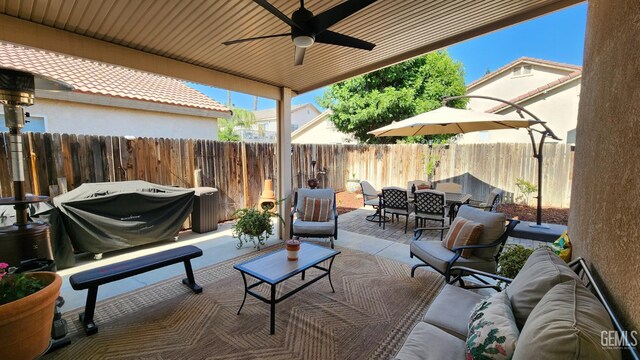 3808 Mariana Way, Bakersfield, CA 93311 - fenced backyard featuring an outdoor living space, outdoor dining space, a patio area, and ceiling fan