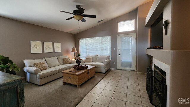 3808 Mariana Way, Bakersfield, CA 93311 - living area featuring vaulted ceiling, ceiling fan, a tiled fireplace, light tile patterned floors, and baseboards