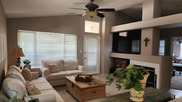 3808 Mariana Way, Bakersfield, CA 93311 - living room featuring a ceiling fan, a tiled fireplace, light carpet, and high vaulted ceiling