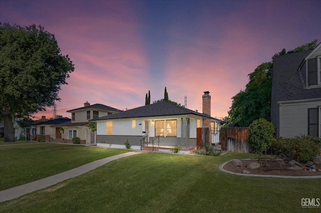 2617 Beech St, Bakersfield, CA 93301 - view of front of house featuring fence, a chimney, and a front yard