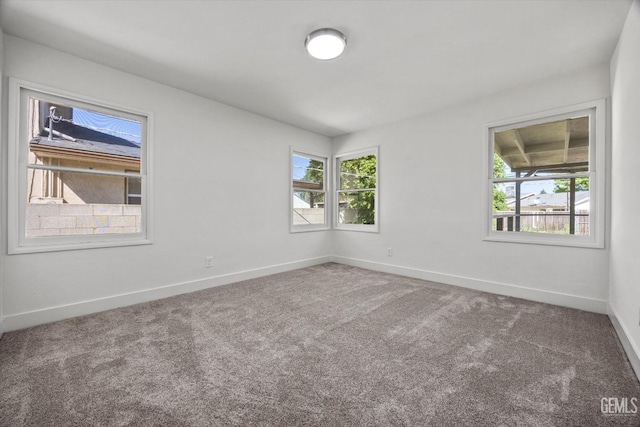 2617 Beech St, Bakersfield, CA 93301 - carpeted spare room featuring baseboards and plenty of natural light