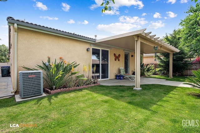 6006 Colchester Pl, Bakersfield, CA 93306 - back of house featuring central AC unit, a patio area, stucco siding, and a yard