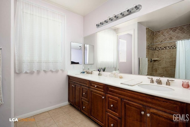 6006 Colchester Pl, Bakersfield, CA 93306 - full bathroom featuring double vanity, a sink, tile patterned floors, and tiled shower