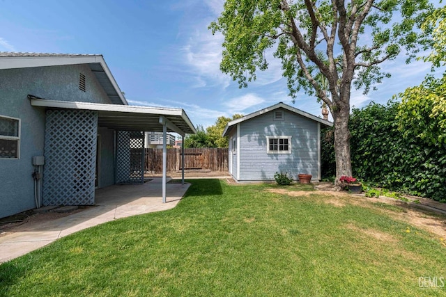 view of yard featuring an outdoor structure and fence