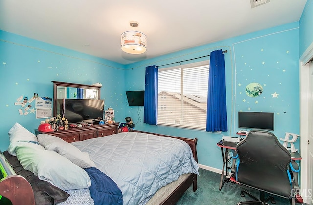 carpeted bedroom with visible vents and baseboards