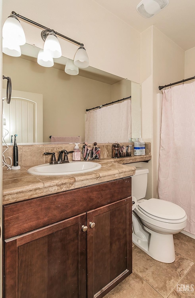 full bathroom with toilet, tile patterned flooring, visible vents, and vanity