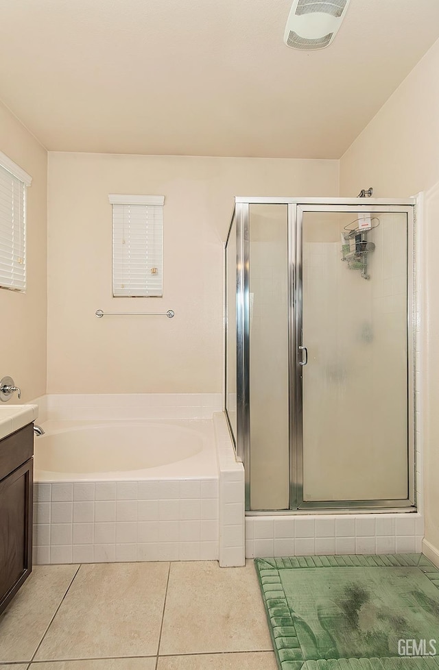 bathroom with a garden tub, visible vents, vanity, a shower stall, and tile patterned flooring