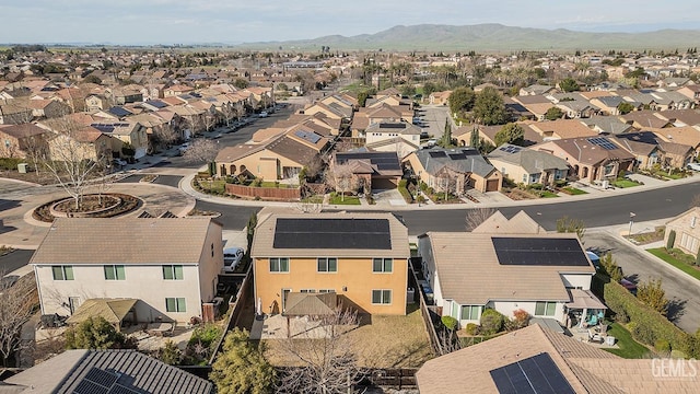 birds eye view of property featuring a mountain view and a residential view