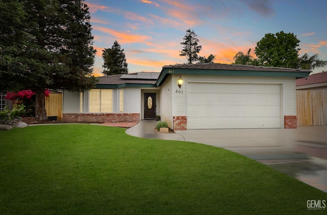 801 Crown Pointe Dr, Bakersfield, CA 93312 - view of front of house with driveway, brick siding, roof mounted solar panels, and an attached garage