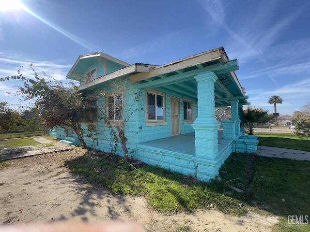 view of home's exterior with covered porch