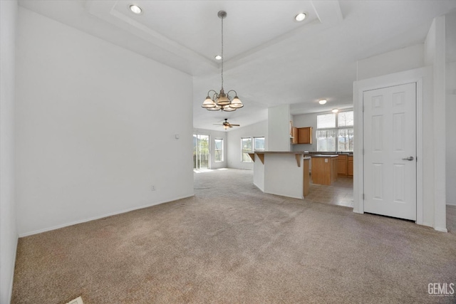 11543 Jay Dr, Caliente, CA 93518 - unfurnished living room with ceiling fan with notable chandelier, recessed lighting, a healthy amount of sunlight, and light colored carpet