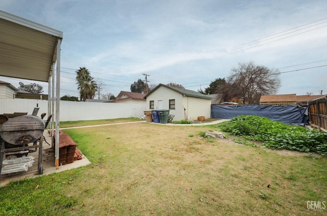 view of yard with a fenced backyard and an outdoor structure