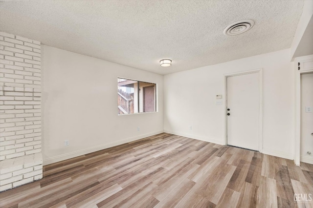 2904 Brock Way, Bakersfield, CA 93306 - empty room featuring light wood finished floors, a textured ceiling, visible vents, and baseboards