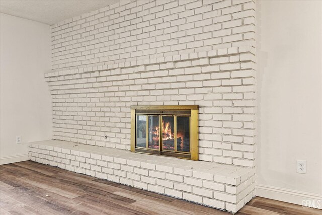 2904 Brock Way, Bakersfield, CA 93306 - room details with a fireplace, wood finished floors, and baseboards